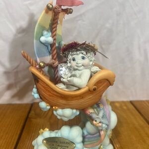 Charming Angel in Rainbow Boat Figurine